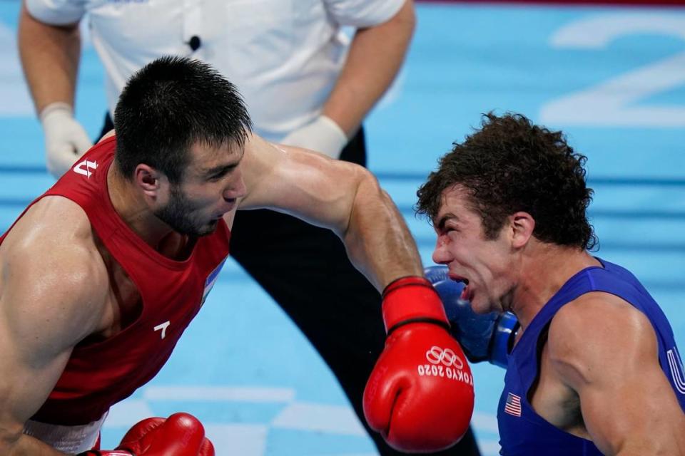 Uzbekistan’s Bakhodir Jalalov, left punches Richard Torrez Jr., from the United States during their men’s super heavyweight (over 91-kg) boxing gold medal match at the 2020 Summer Olympics, Sunday, Aug. 8, 2021, in Tokyo, Japan.