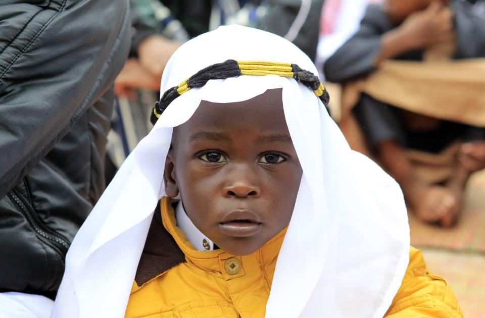 A boy waits to perform prayers for the Muslim festival of Eid-al-Adha in Kibera slum in Kenya's capital Nairobi