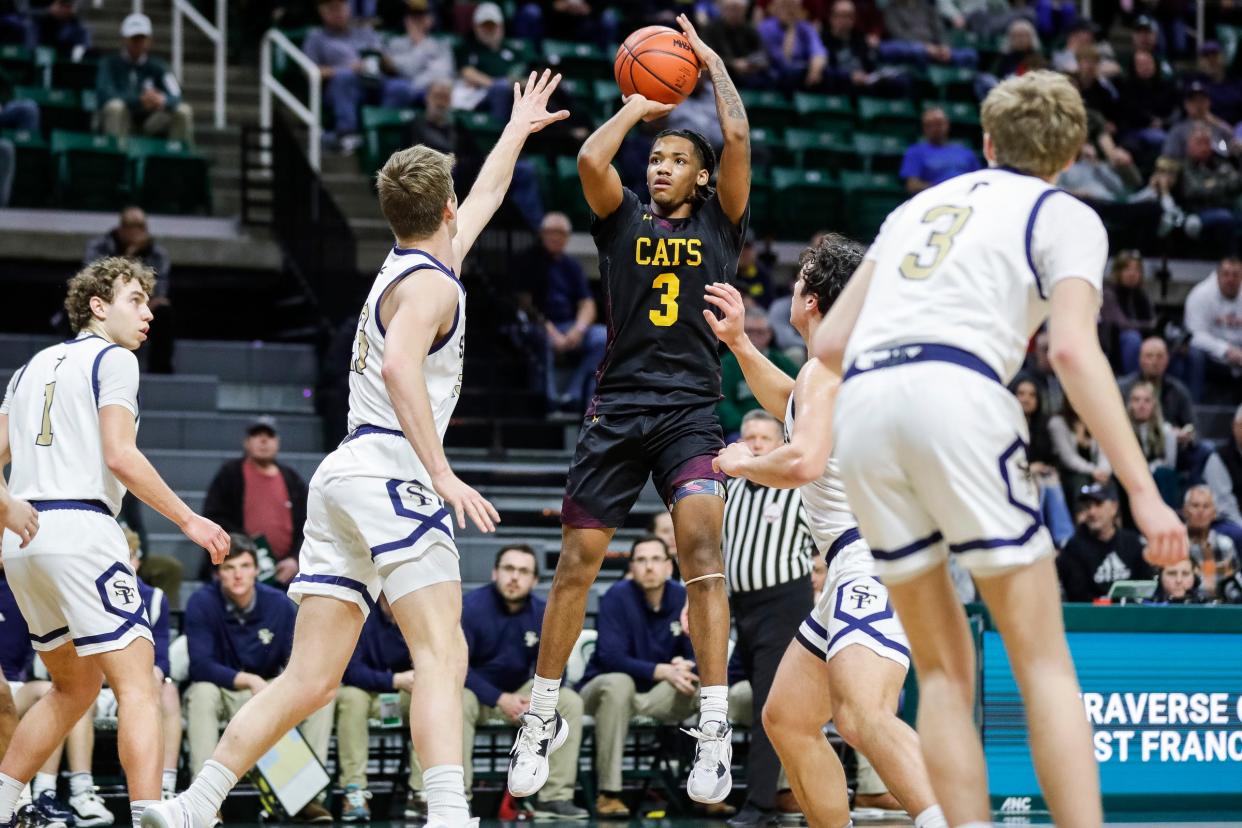 Niles Brandywine guard Jaremiah Palmer (3) makes a jump shot against Traverse City St. Francis  during the first half of the MHSAA boys Division 3 semifinal at Breslin Center in East Lansing on Thursday, March 23, 2023.