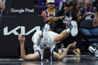 Dallas Mavericks forward Maxi Kleber (42) hits the court after scoring against the Phoenix Suns during the second half of Game 1 in the second round of the NBA Western Conference playoff series Monday, May 2, 2022, in Phoenix. (AP Photo/Matt York)