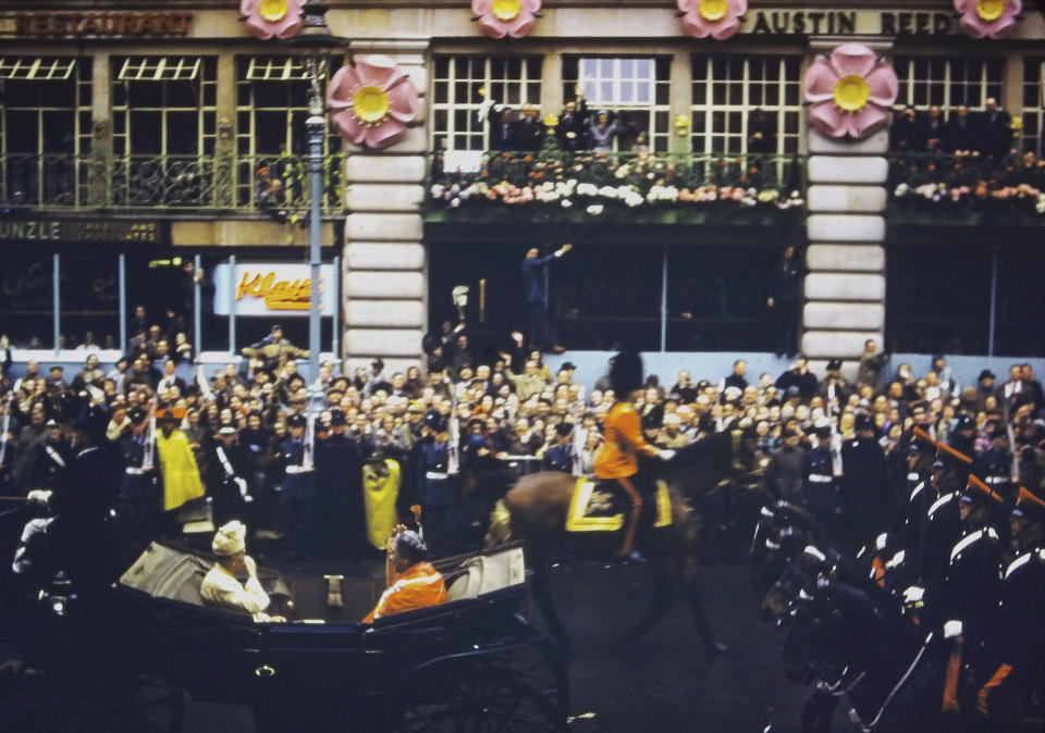 In this photo provided by Max Hancock, Queen Salote Tupou III of Tonga sits in a carriage during Queen Elizabeth II’s coronation parade in London, June 2, 1953. Hancock, a 19-year-old from Sparks, Georgia, was a U.S. airman stationed at RAF Brize Norton near Oxford at the time of the coronation. As Americans, Hancock and his buddies had no allegiance to the British monarch, but they knew the coronation would be a historic event so they made the 70-mile trip to London by bus and train, then joined the crowds hoping to see the queen pass by. (Max Hancock via AP)