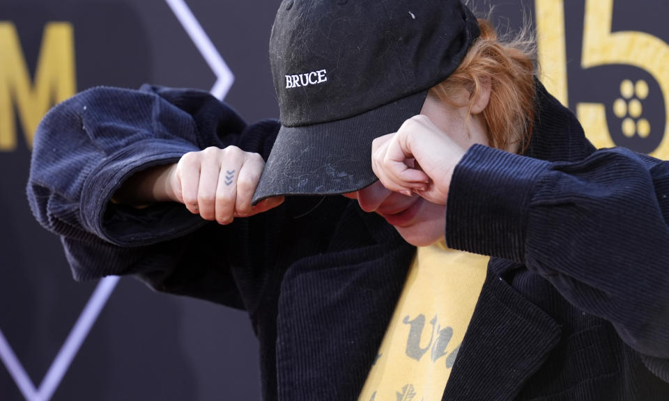Tallulah Willis, daughter of "Pulp Fiction" cast member Bruce Willis, shows off her cap in honor of her father at a 30th anniversary screening of the film on the opening night of th TCM Classic Film Festival, Thursday, April 18, 2024, in Los Angeles. (AP Photo/Chris Pizzello)