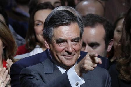 Francois Fillon, former French prime minister and member of Les Republicains political party, attends a rally as he campaigns in the second round for the French center-right presidential primary election in Paris, France, November 25, 2016. REUTERS/Philippe Wojazer