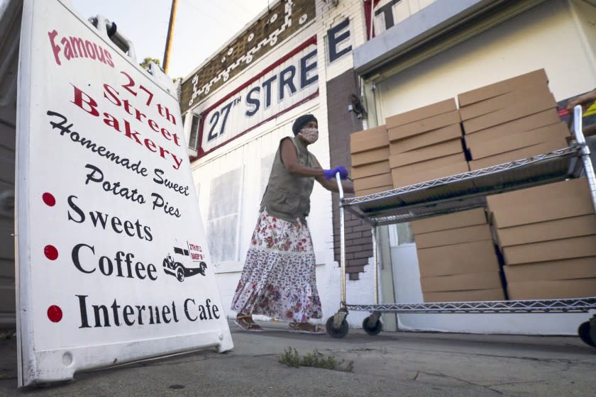 Rita Spencer picks a load freshly baked pies for delivery to 25 business in Gardena, from 27th Street Bakery Shop