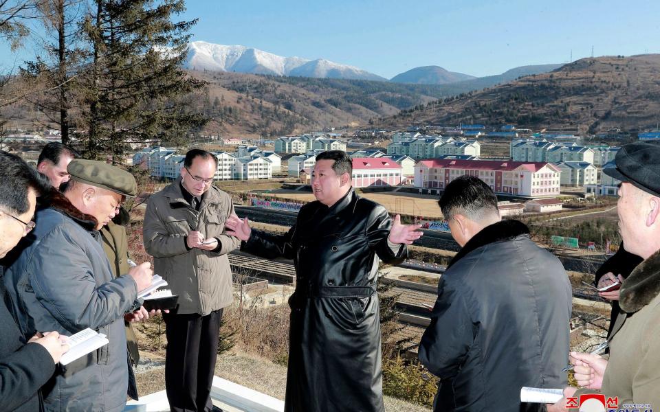 This undated photo provided on Nov. 16, 2021, by the North Korean government, North Korean leader Kim Jong Un, center, inspects a major development project site in Samjiyon, Ryanggang province, North Korea - KCNA via KNS/AP 