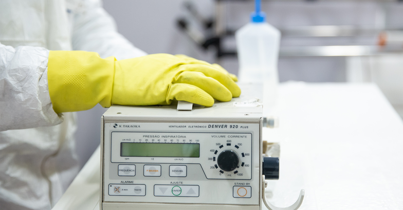 A technician of the General Motors' factory repairs a ventilator 