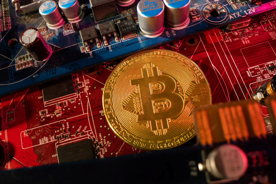 A representation of cryptocurrency Bitcoin is placed on a PC motherboard, in this illustration taken June 16, 2023. REUTERS/Dado Ruvic/Illustration