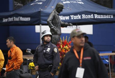 A New York City Police (NYPD) officer stands guard near the finish line of the New York City Marathon November 1, 2013. REUTERS/Mike Segar