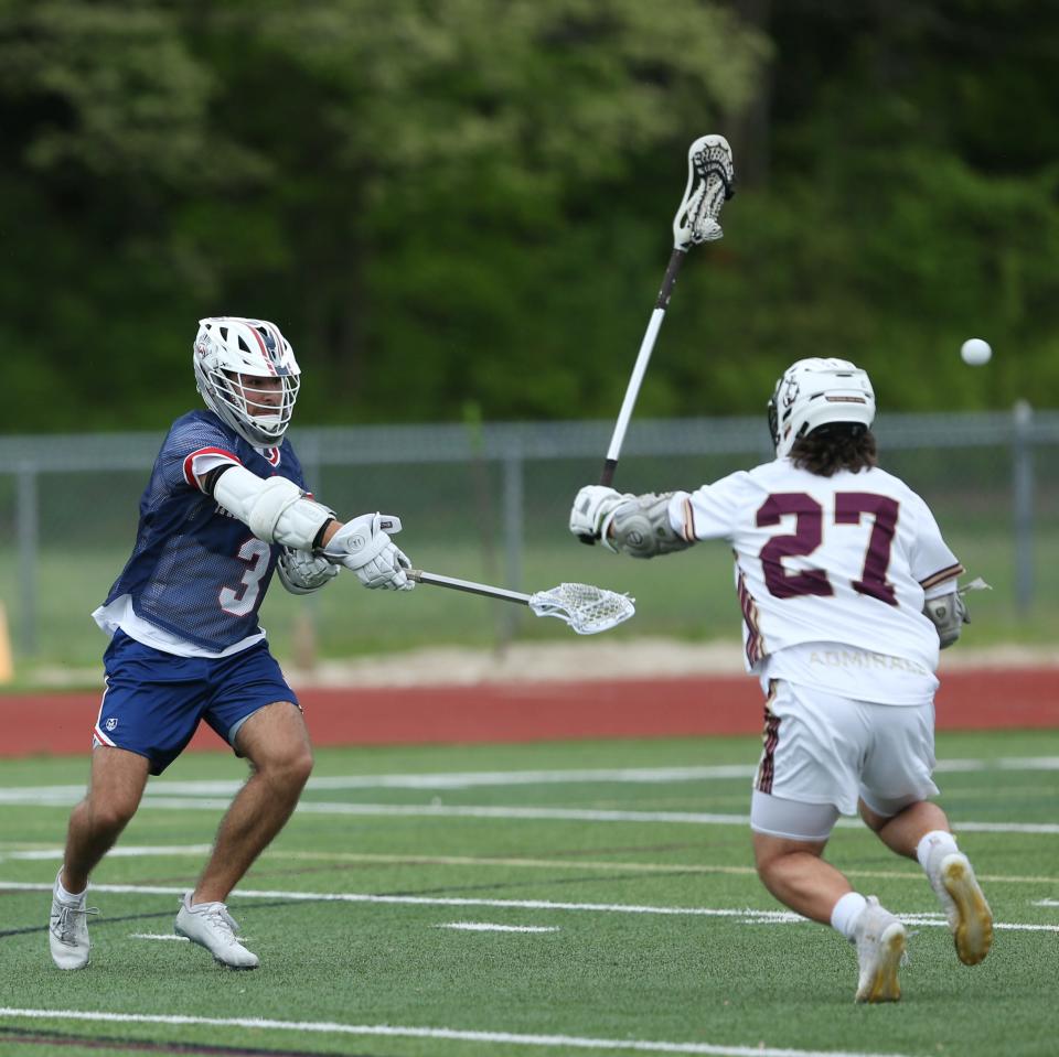 Wappingers' Brayden Kuczma shoots the ball over Arlington's Nicholas DeGuisto during a game on May 10, 2024.