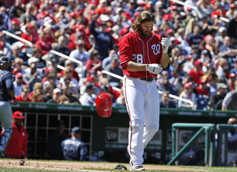 Washington Nationals' Jayson Werth drops his helmet after striking out during the third inning of a baseball game against the Atlanta Braves at Nationals Park, Sunday, April 6, 2014, in Washington. (AP Photo/Alex Brandon)