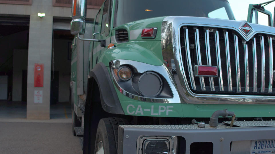 The U.S. Forest Service drives in green trucks to the scene of fires, not in the traditional red trucks usually associated with firefighters.  