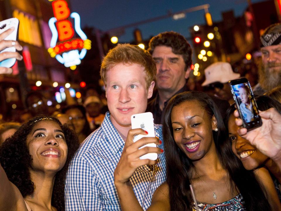 matthew hicks surrounded by people snapping photos on i wanna marry harry