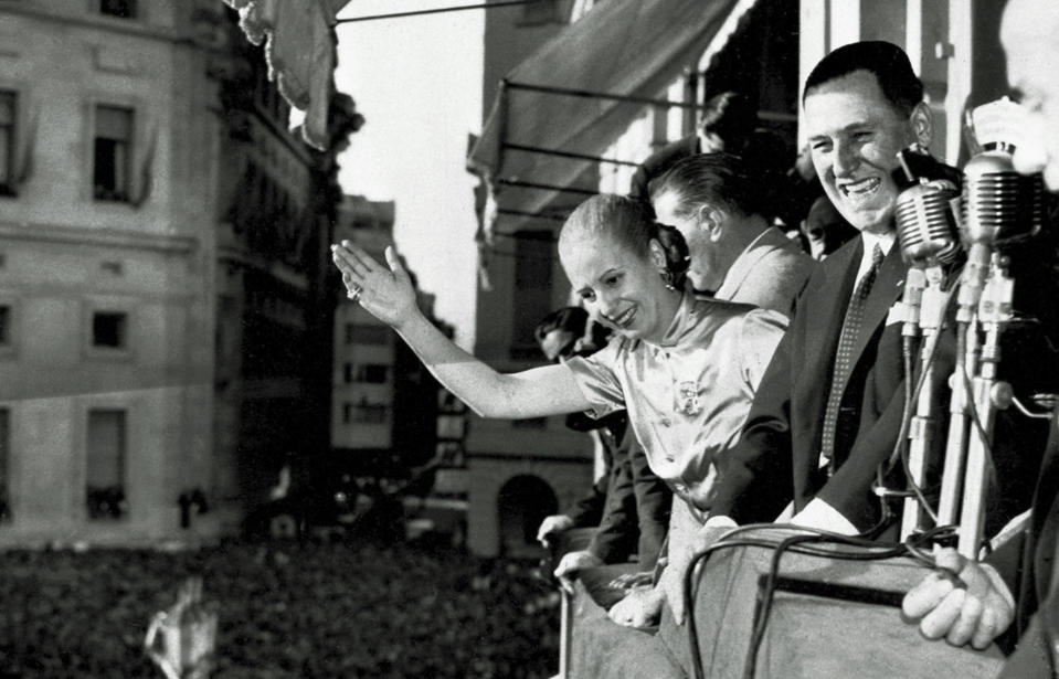 FILE - In this Oct. 17, 1950, file photo, President Juan Peron and his wife Eva wave from the balcony of Casa Rosada, Government House, in Buenos Aires as Argentina celebrated Loyalty Day. Decades after Eva Peron's death, tourists still visit the site where she greeted adoring masses from the balcony. (AP Photo, File)