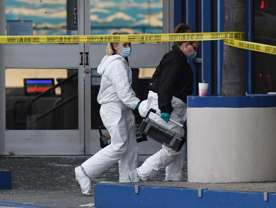 Police investigators work at the Gable House Bowl center after three men were killed and four injured in a shooting at the bowling alley in Torrance, California, according to police on Jan. 5, 2019. (Photo: Mark Ralston/AFP/Getty Images)
