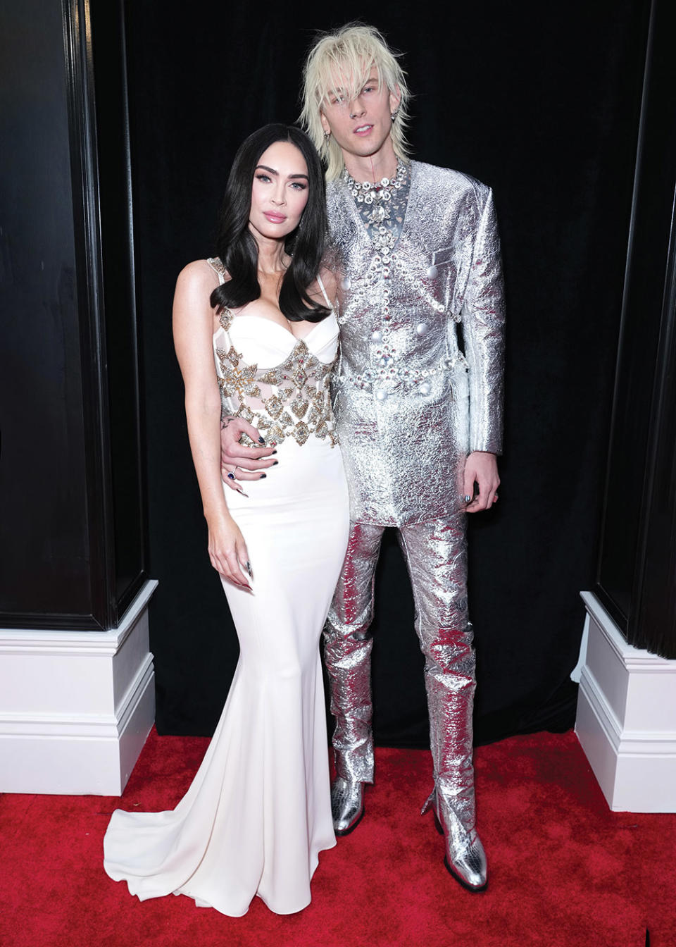 At the Grammys, nominee Machine Gun Kelly shone in silver foil, while Megan Fox kept it more “simple,” said her stylist.