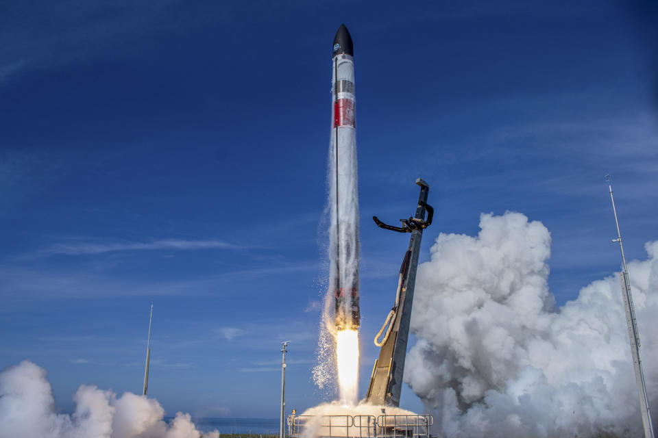 In this image supplied by Rocket Lab, the Electron rocket blasts off for its "There And Back Again" mission from their launch pad on the Mahia Peninsula, New Zealand, Tuesday, May 3, 2022. The California-based company regularly launches 18-meter (59-foot) rockets from the remote Mahia Peninsula in New Zealand to deliver satellites into space. (Rocket Lab via AP)