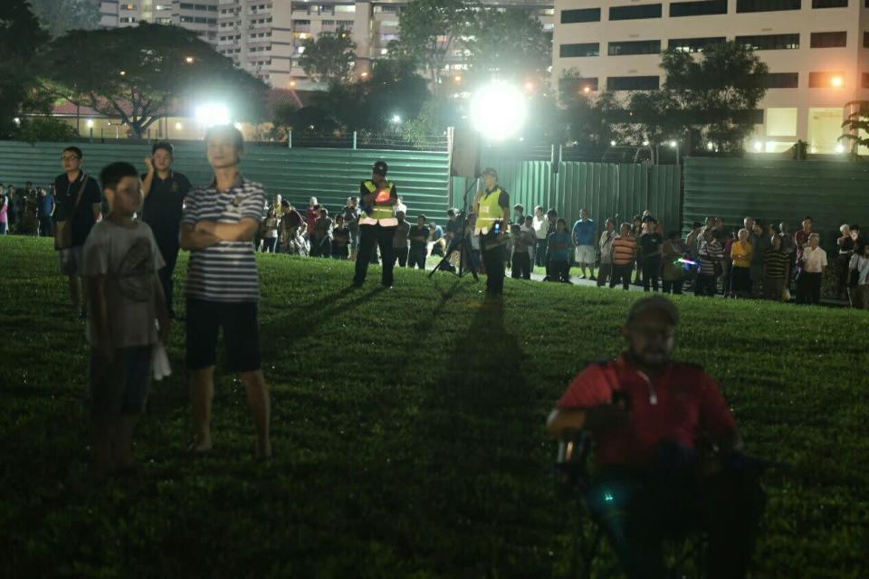 Supporters standing on the road instead of the muddy field. (Photo: Joseph Nair)