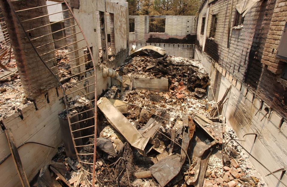 A Boys and Girls Club Youth Leadership Retreat building was destroyed by the Rodeo-Chediski Fire on June 29, 2002 outside the community of Pinedale.