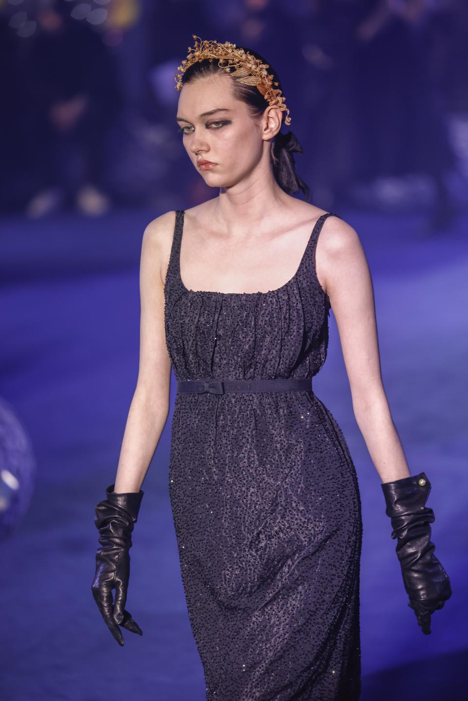 A model wears a creation as part of the Christian Dior Fall/Winter 2023-2024 ready-to-wear collection presented Tuesday, Feb. 28, 2023 in Paris. (Vianney Le Caer/Invision/AP)