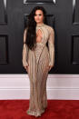 <p>Va-va-voom! Lovato looked absolutely stunning in a beaded Julian Macdonald gown with cutout detailing and a high collar. </p>