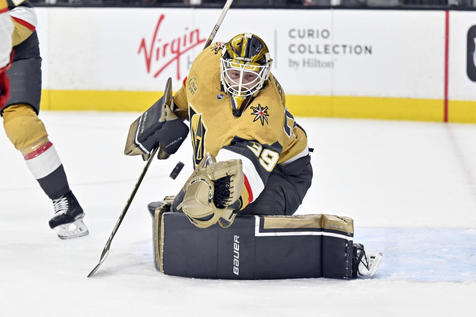 Vegas Golden Knights goaltender Laurent Brossoit defends against the Calgary Flames during the first period of an NHL hockey game Thursday, Feb. 23, 2023, in Las Vegas. (AP Photo/David Becker)