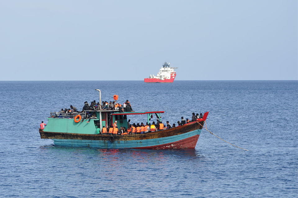 CHRISTMAS ISLAND - OCTOBER 13: Suspected asylum seekers arrive at Christmas Island, after receiving assistance by Australian Navy, on October 13, 2012 on Christmas Island. Reports suggest that a vessel was spotted by an RAAF maritime patrol plane, and HMAS Bundaberg and HMAS Wollongong assisted with the transfer. (Photo by Scott Fisher/Getty Images)