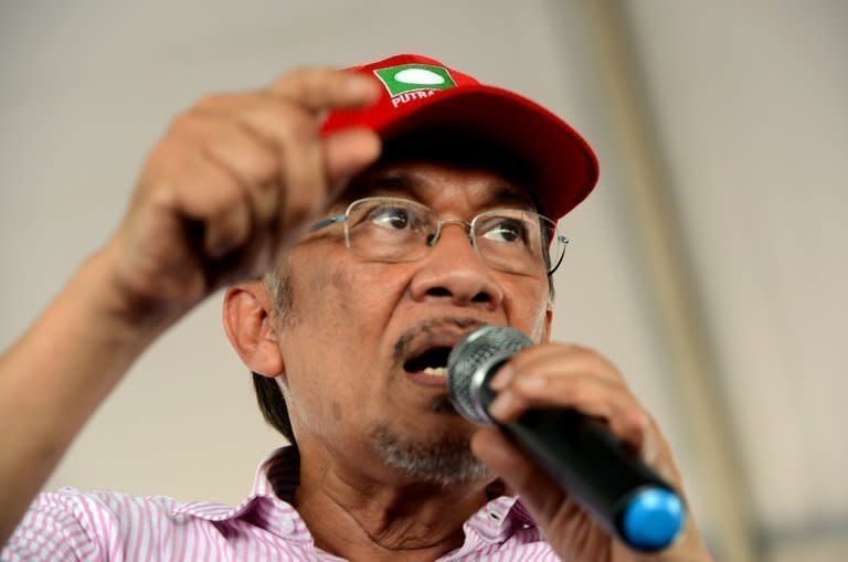 Malaysian opposition leader Anwar Ibrahim speaks at an election rally in Putrajaya on May 1, 2013. Anwar said only fraud can stop his Malaysian opposition from scoring a historic election win as the rival sides launched a last-ditch campaign blitz Saturday on the eve of a tense vote