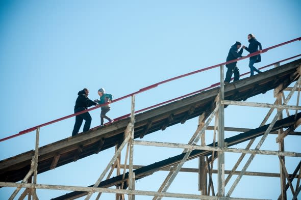 Theme park visitors climb off rollercoaster that broke down midair