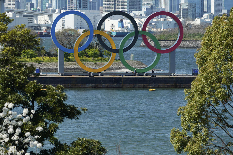 The Olympic rings is seen at Tokyo's Odaiba district Tuesday, March 24, 2020. The CEO of the Tokyo Olympics and the IOC member in charge of Japan's games have both dismissed a new study from the University of Oxford that finds Tokyo is the most expensive Summer Games dating back to 1960. (AP Photo/Eugene Hoshiko, File)