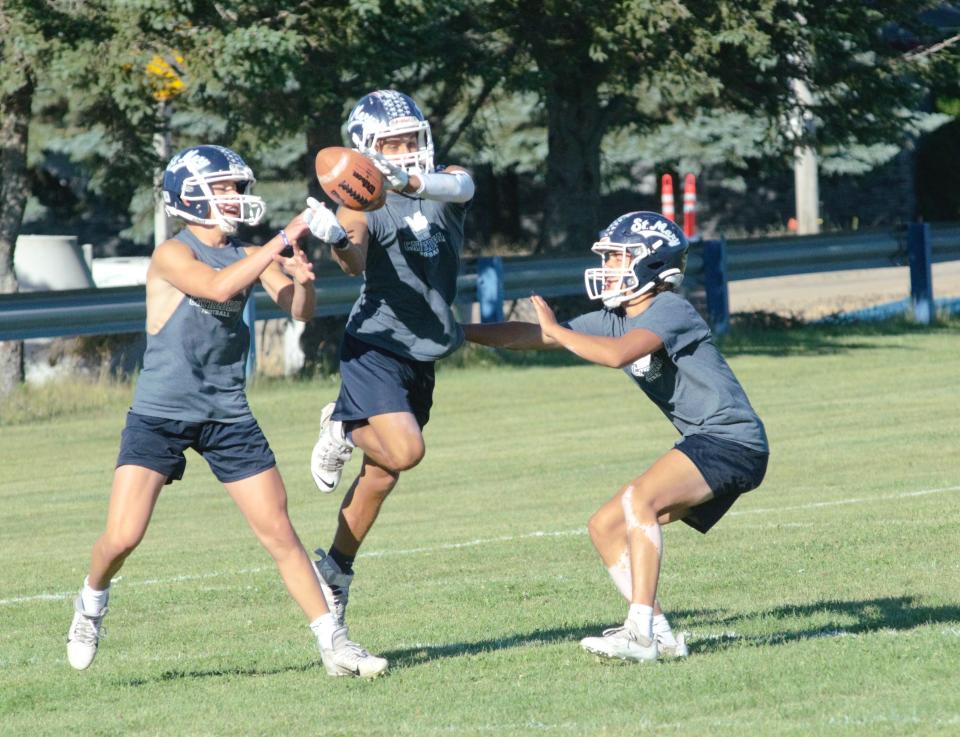 Gaylord St. Mary's football players practice pass defense during a practice on Tuesday, August 9.