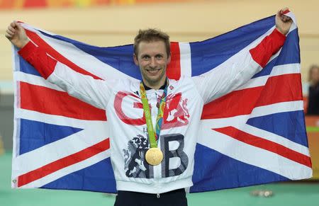 2016 Rio Olympics - Cycling Track - Victory Ceremony - Men's Sprint Victory Ceremony - Rio Olympic Velodrome - Rio de Janeiro, Brazil - 14/08/2016. Jason Kenny (GBR) of Britain celebrates winning the gold medal. REUTERS/Matthew Childs