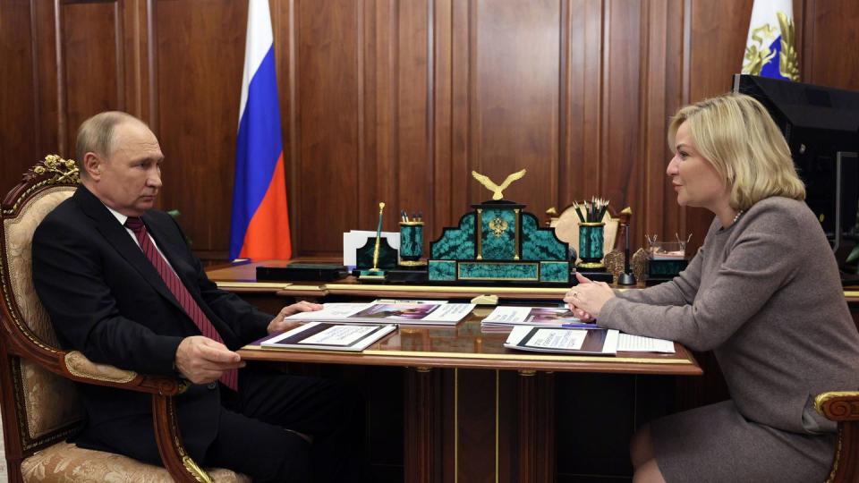 FILE - Russian President Vladimir Putin listens to Russian Culture Minister Olga Lyubimova during their meeting in Moscow, Russia, Oct. 3, 2022. (Gavriil Grigorov, Sputnik, Kremlin Pool Photo via AP, File)