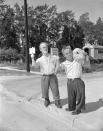 <p>Roy Smith, left, and Harry Burman, right, two dwarfes from London, formerly with Ringling Bros., Barnum and Bailey Circus, get set for a long trip, maybe not to London, but somewhere for a job. They arrived aboard the train returning to circus winter quarters in Sarasota, Fla., July 20, 1956. (AP Photo) </p>