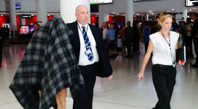 Fox was escorted through Perth airport after being extradited. Source: ABC News/David Weber