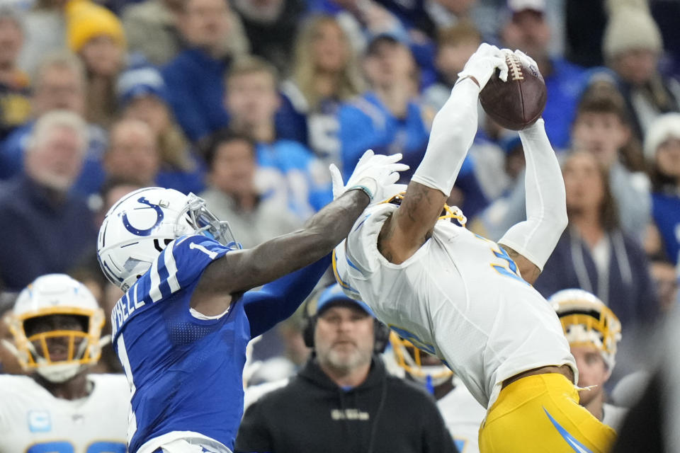 Los Angeles Chargers safety Derwin James Jr. (3) makes an interception against Indianapolis Colts' Parris Campbell (1) during the first half of an NFL football game, Monday, Dec. 26, 2022, in Indianapolis. (AP Photo/AJ Mast)