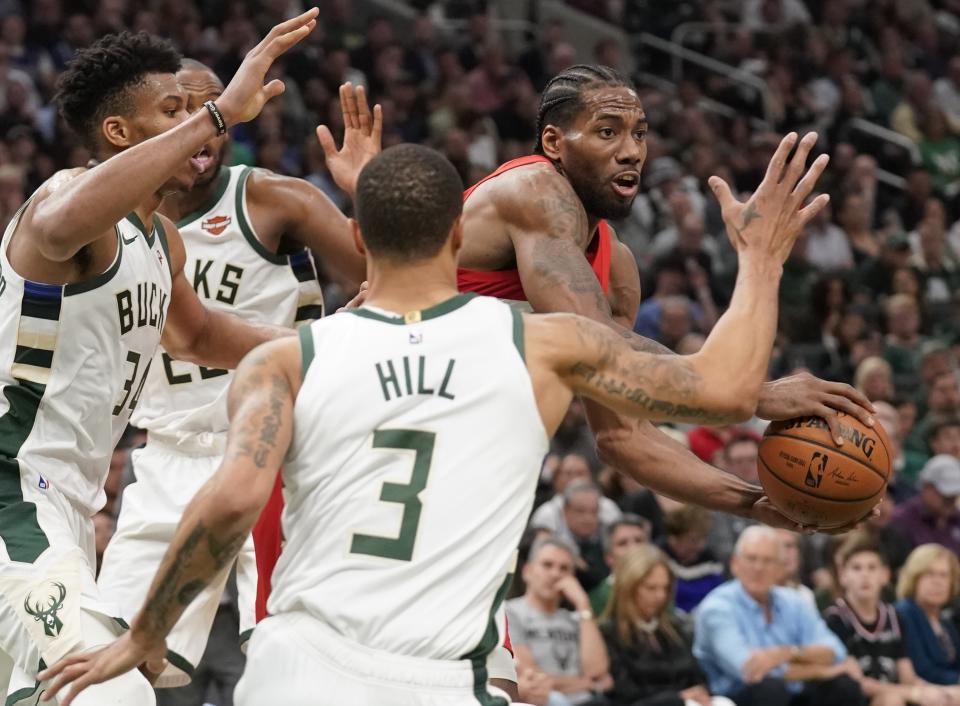 Toronto Raptors' Kawhi Leonard looks to pass during the second half of Game 5 of the NBA Eastern Conference basketball playoff finals against the Milwaukee Bucks Thursday, May 23, 2019, in Milwaukee. The Raptors won 105-99 to take a 3-2 lead in the series. (AP Photo/Morry Gash)