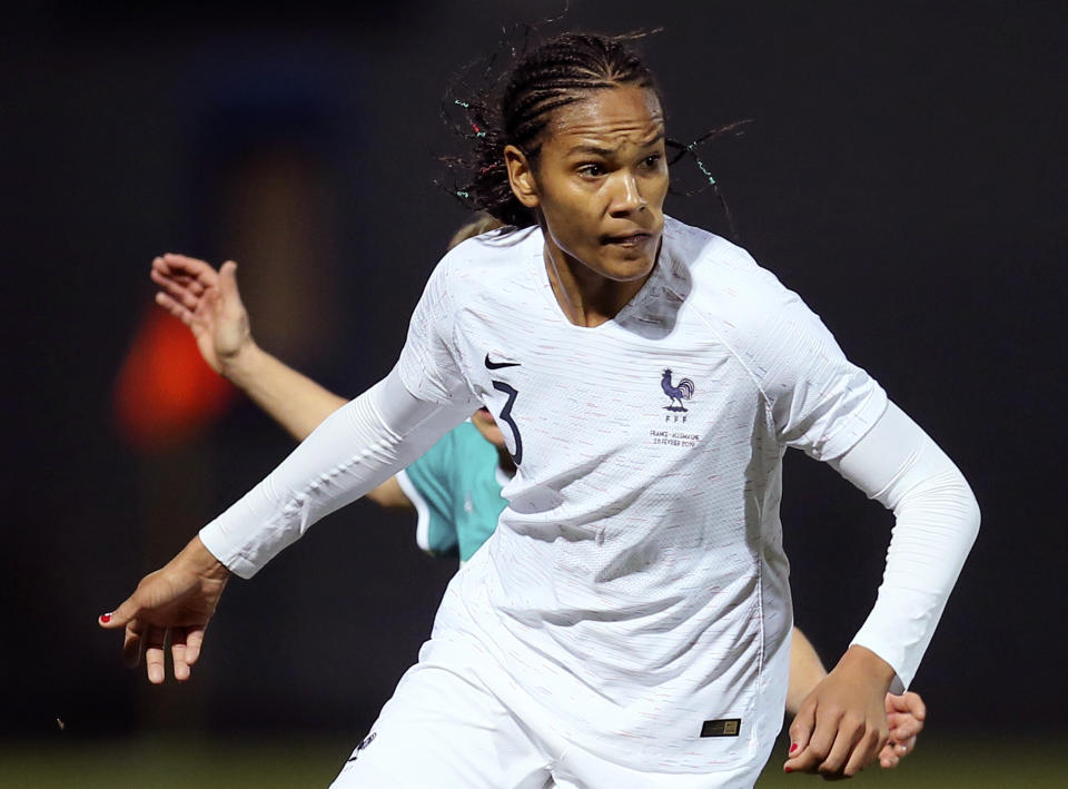 FILE - In this Thursday, Feb. 28, 2019 file photo, France's Wendie Renard controls the ball during their women's international friendly soccer match against Germany at Francis-le-Basser stadium in Laval, western France. With an experienced side featuring seven players from the Lyon side which recently won the Champions League for the fourth straight year, host France will be among the favorites for the Women's World Cup. Among the seven Lyon players coach Corinne Diacre can count on are imposing center half Wendie Renard and midfield schemer Amandine Henry, who will captain France. (AP Photo/David Vincent, file)