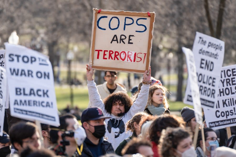 BOSTON, MASSACHUSETTS, UNITED STATES – 2023/01/28: A protester holds a placard saying ‘Cops Are Terrorist’ during the demonstration. Protesters in Boston held a rally following the release of the video which showed the police beating of Tyre Nichols. Nearly 100 rally goers met on the Boston Common to listen to speakers and activists from the community. Later, the rally moved to the street marching around Downtown Boston. (Photo by Vincent Ricci/SOPA Images/LightRocket via Getty Images)