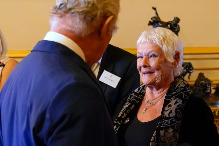 Britain's King Charles III speaks to actress Judi Dench, who has become one of the first female members of the Garrick Club (Andrew Matthews)