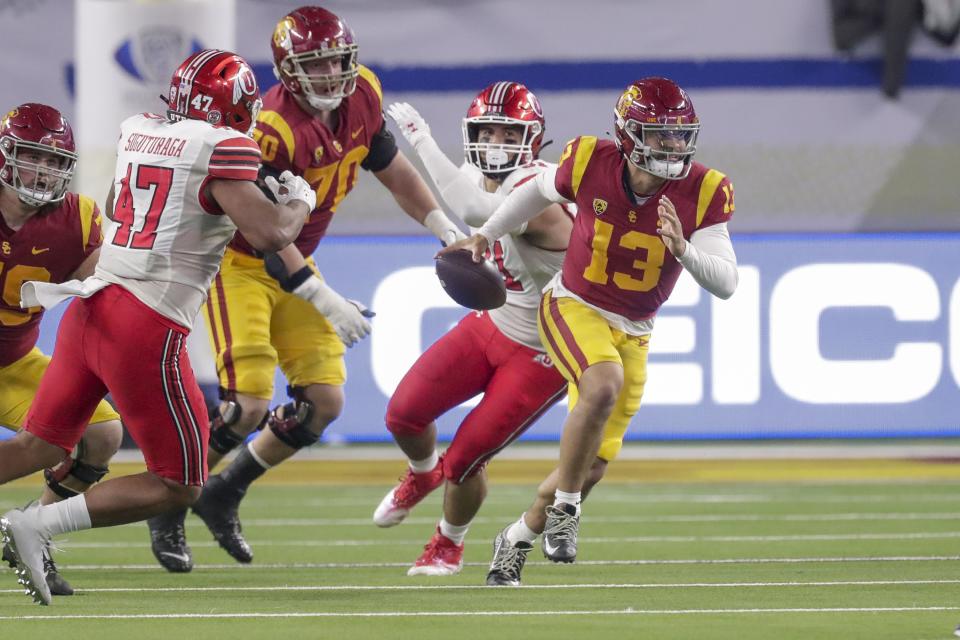 USC Trojans QB Caleb Williams runs with the ball while playing the Utah Utes during the Pac-12 Championship at the Allegiant Stadium in Las Vegas on Friday, Dec. 2, 2022. The Utes won 47-24.