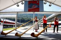 Alphorn blowers perform during the opening ceremony of the newly built Ceneri Base Tunnel near Camorino