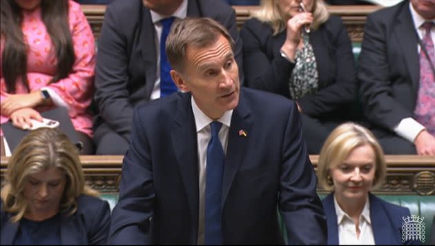 Liz Truss looks on as Jeremy Hunt rips up the core aspects of the mini-budget. (Photo: House of Commons - PA Images via Getty Images)