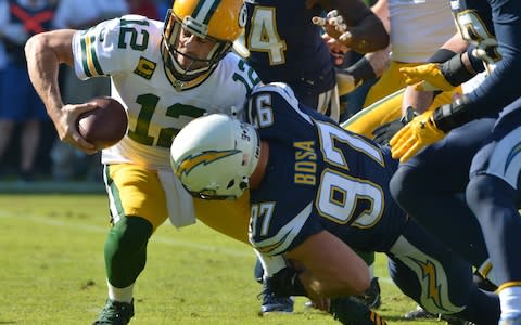 Los Angeles Chargers defensive end Joey Bosa (97) sacks Green Bay Packers quarterback Aaron Rodgers (12) during the first quarter at Dignity Health Sports Park - Credit: USA Today