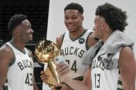 Milwaukee Bucks' Thanasis Antetokounmpo, Giannis Antetokounmpo and Jordan Nwora have some fun during an NBA basketball media day Monday, Sept. 27, 2021, in Milwaukee. (AP Photo/Morry Gash)