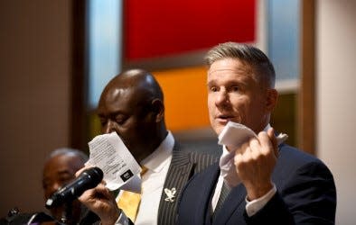 Attorney Bobby DiCello, who represents the family of Frank E. Tyson of Canton, tears up a copy of the Canton Police Department Code of Conduct during a press conference Thursday at St. Paul AME Church in Canton. Tyson died April 18 after he was arrested by Canton police.