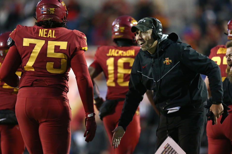 Dec 29, 2023; Memphis, TN, USA; Iowa State Cyclones head coach Matt Campbell (right) reacts with Iowa State Cyclones offensive linemen James Neal (75) during the second half against the Memphis Tigers at Simmons Bank Liberty Stadium. Mandatory Credit: Petre Thomas-USA TODAY Sports