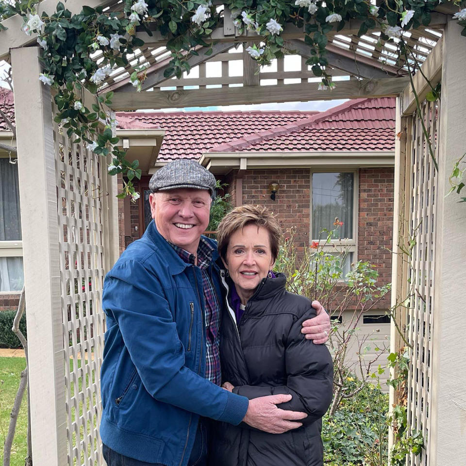 Alan Fletcher and Jackie Woodburne pose under an arch on Location for Neighbours for the last time ever.