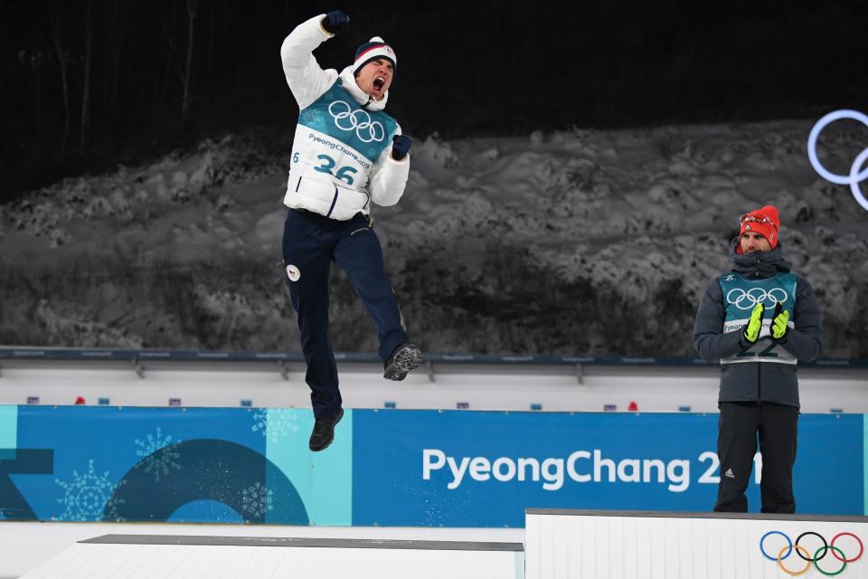 <p>Silver medallist Czech Republic’s Michal Krcmar jumps in the air, as gold winner Germany’s Arnd Peiffer looks on during the victory ceremony following the men’s 10km sprint biathlon event during the Pyeongchang 2018 Winter Olympic Games on February 11, 2018, in Pyeongchang. / AFP PHOTO / FRANCK FIFE </p>