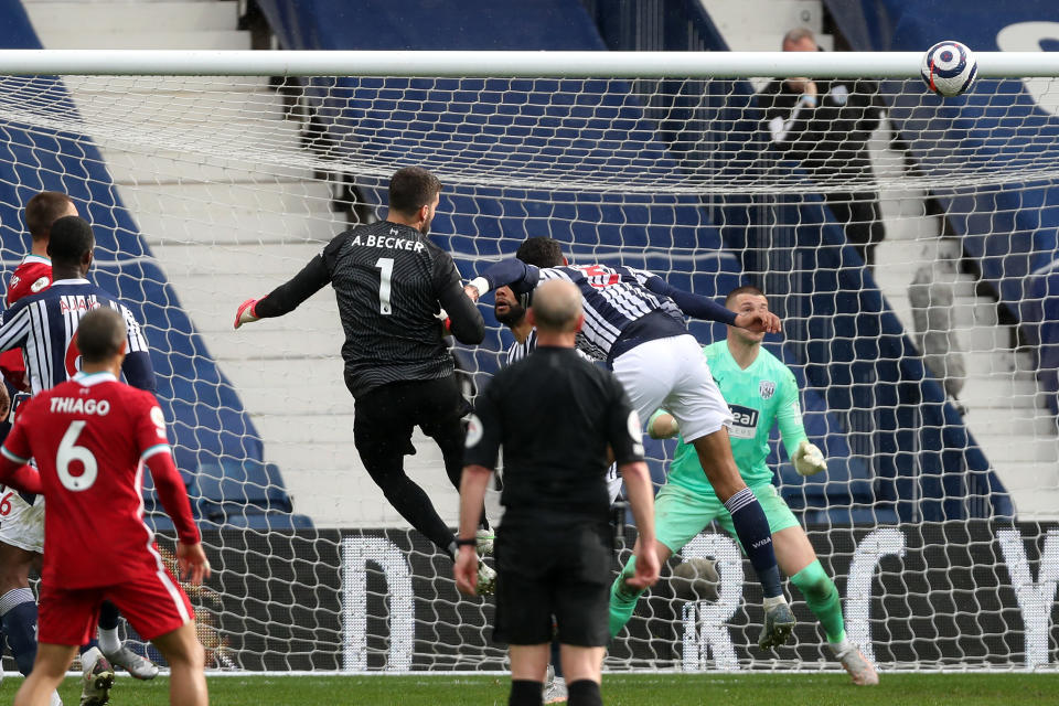 <p>WEST BROMWICH, ENGLAND - MAY 16: Goalkeeper Alisson Becker of Liverpool scores a goal to make it 1-2 during the Premier League match between West Bromwich Albion and Liverpool at The Hawthorns on May 16, 2021 in West Bromwich, United Kingdom. (Photo by Adam Fradgley - AMA/West Bromwich Albion FC via Getty Images)</p>
