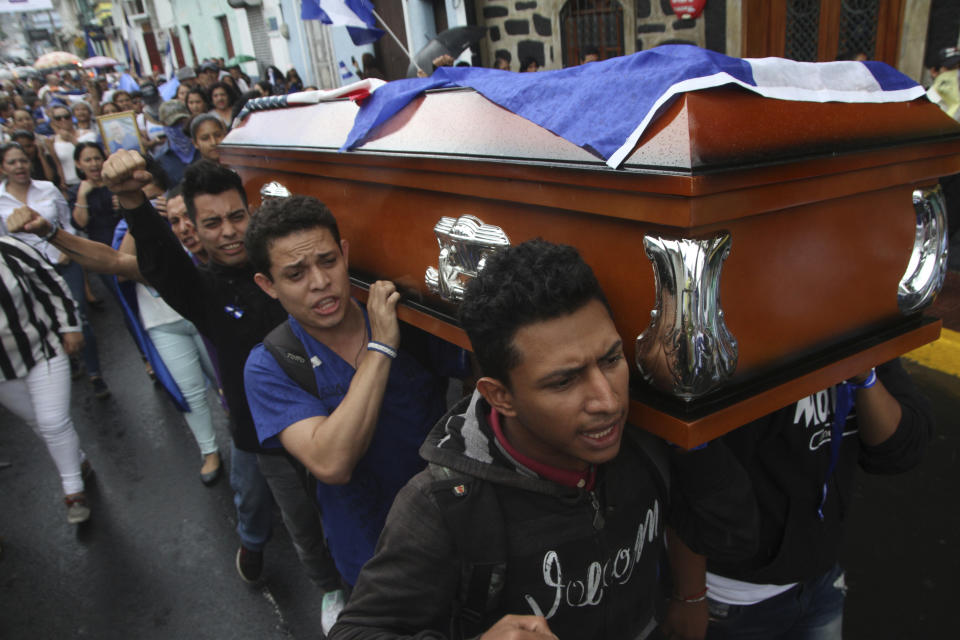 Men carry the coffin of Eddy Montes Praslin to a church before his burial in Matagalpa, Nicaragua, Sunday, May 19, 2019. Montes Praslin, a Nicaraguan-American dual national who died in a prison disturbance in Nicaragua, served in the U.S. Navy and was a staunch opponent of the government of President Daniel Ortega, according to his cousin Marvin Montes. (AP Photo/Oscar Duarte)